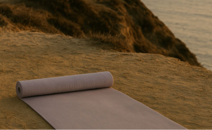 A yoga mat unrolled on a cliff above the sea
